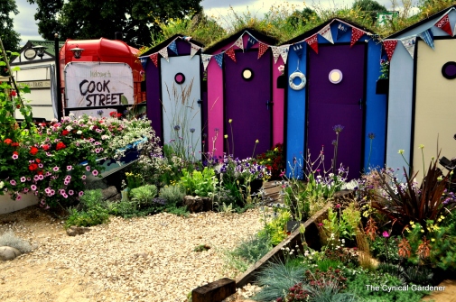 Bright and colourful plantings with shingle paths